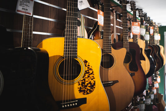 Acoustic Guitars Hanging on a wall